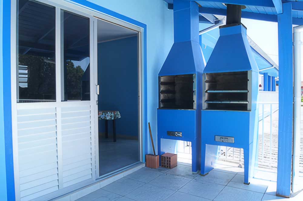 Varanda com churrasqueira coletiva